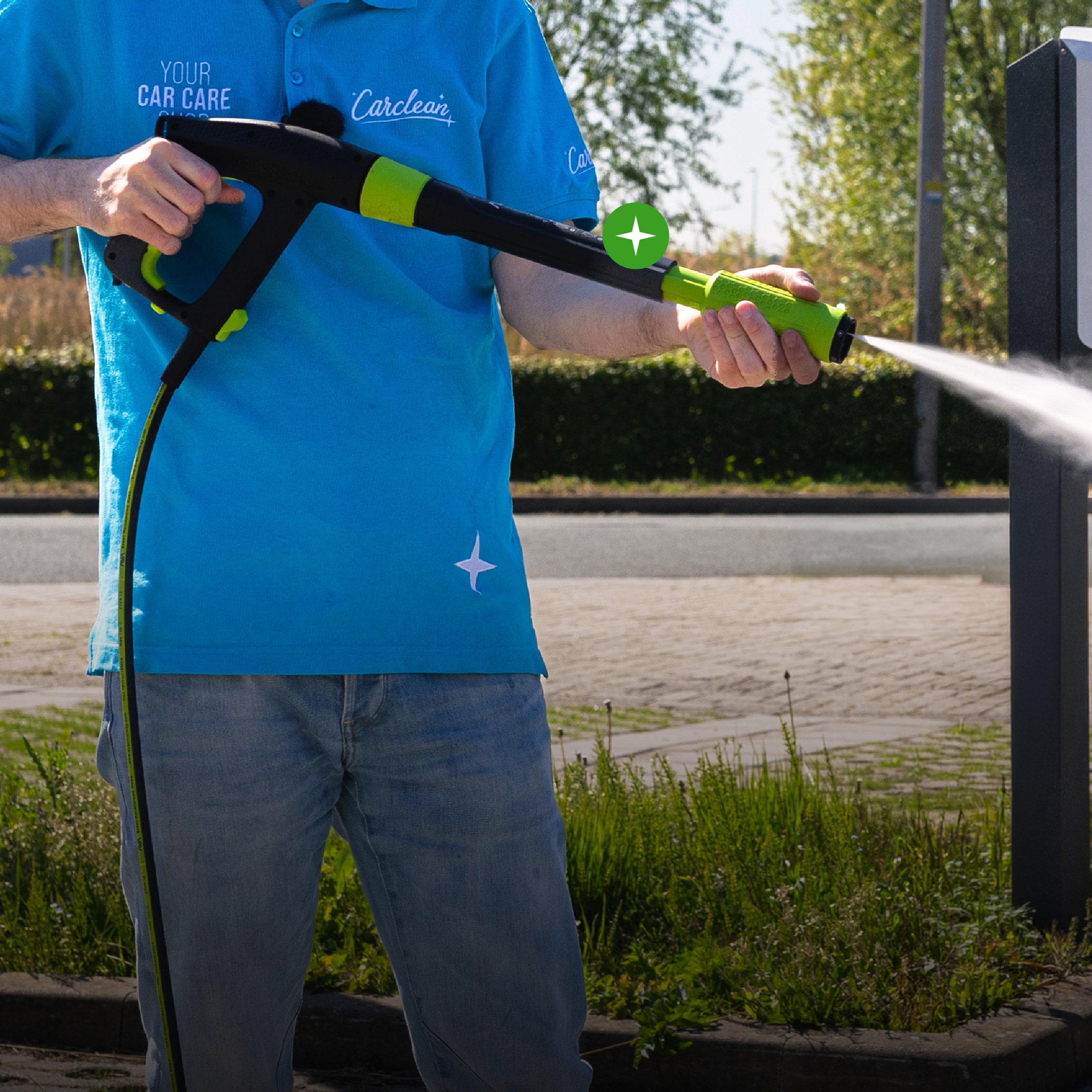 pressure washer, watering wand, green nozzle, blue polo, outdoor spray