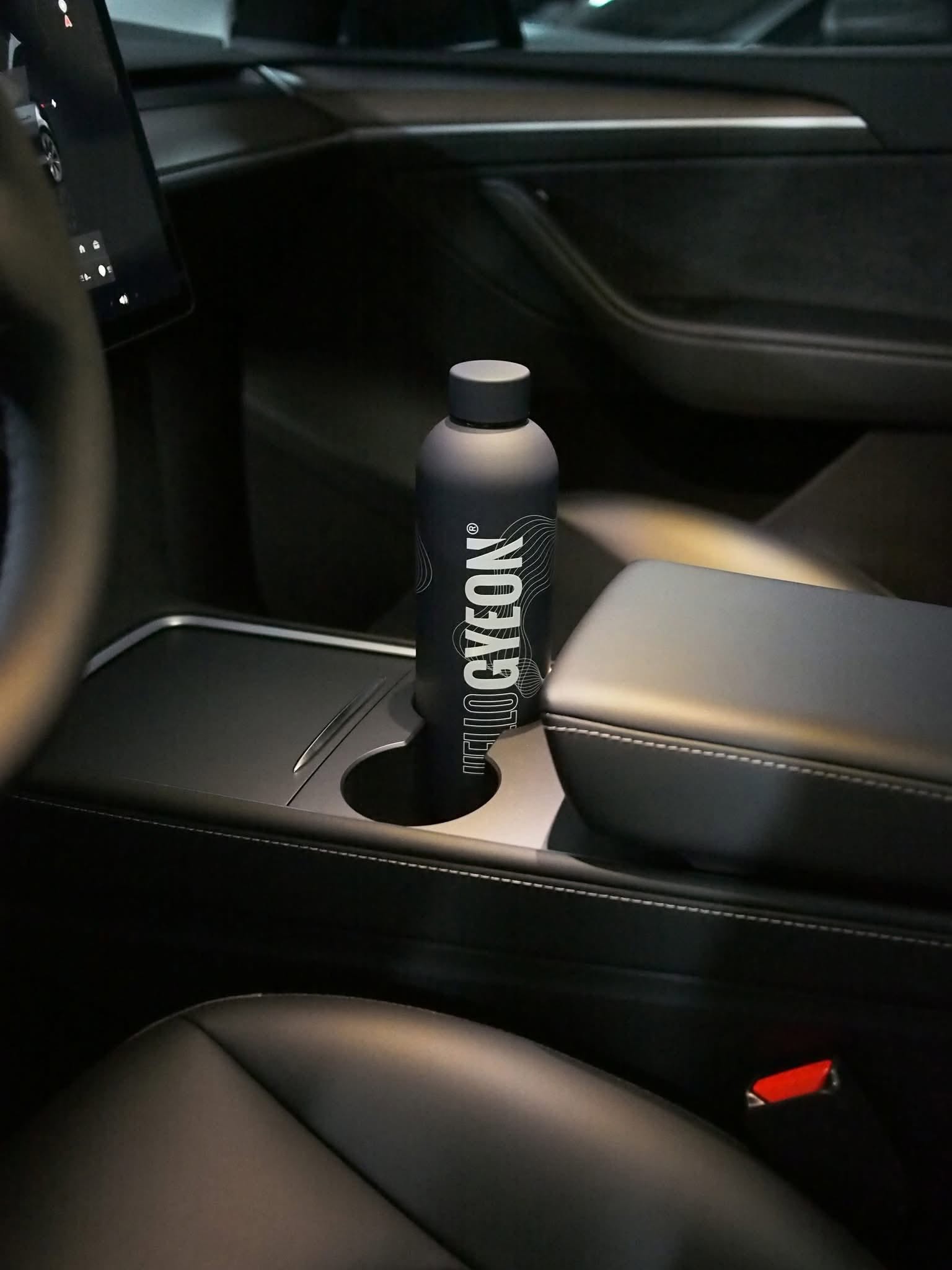 plastic bottle, water bottle, car interior, cup holder, drink container
