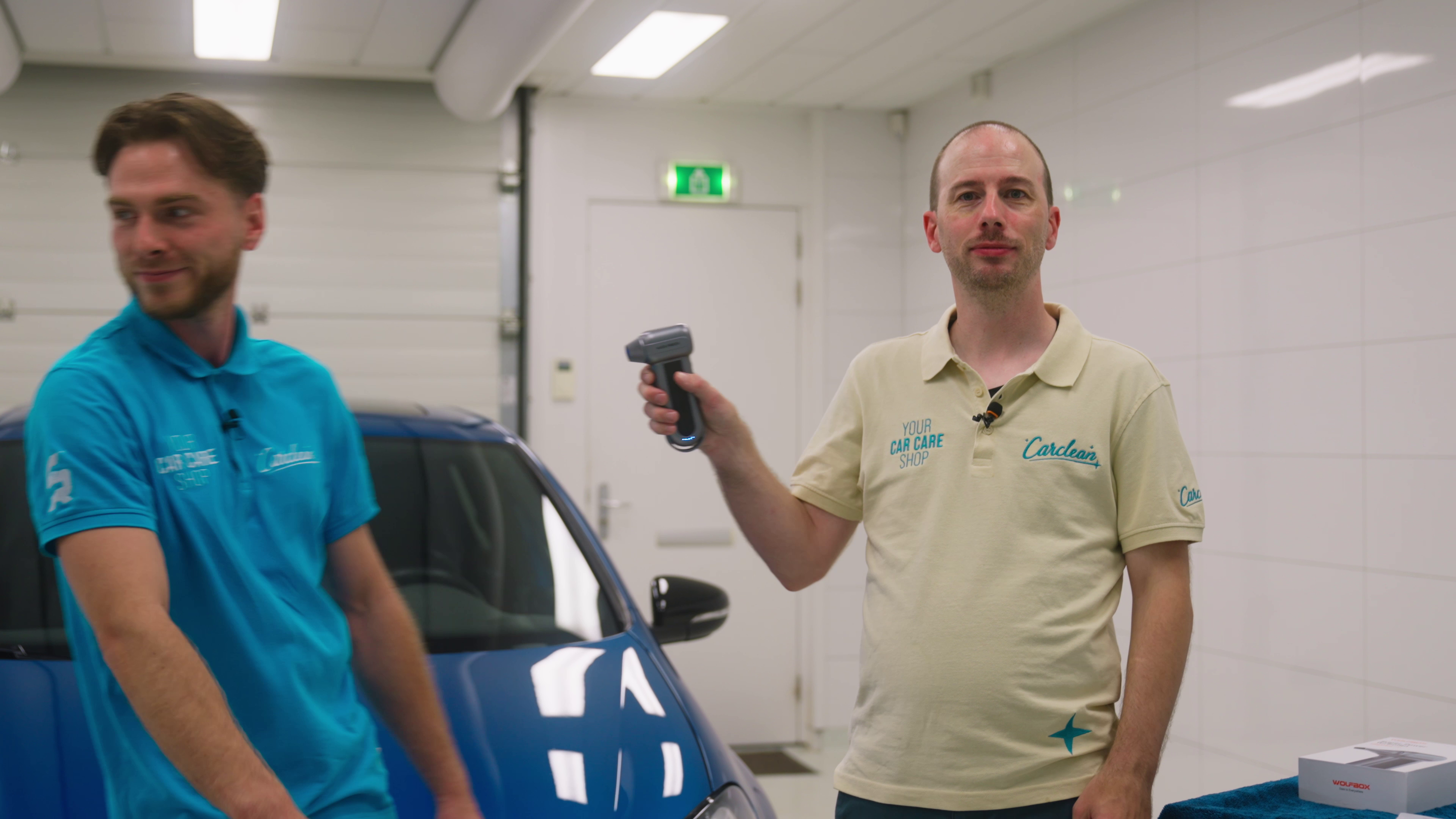 auto detailing, car care, handheld device, garage, two men